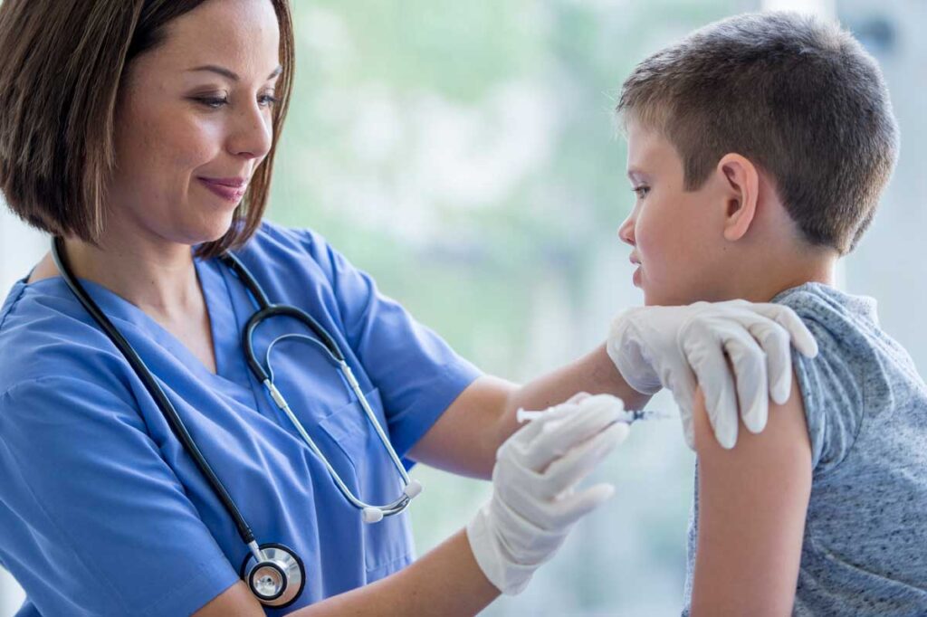 little boy getting a vaccine web